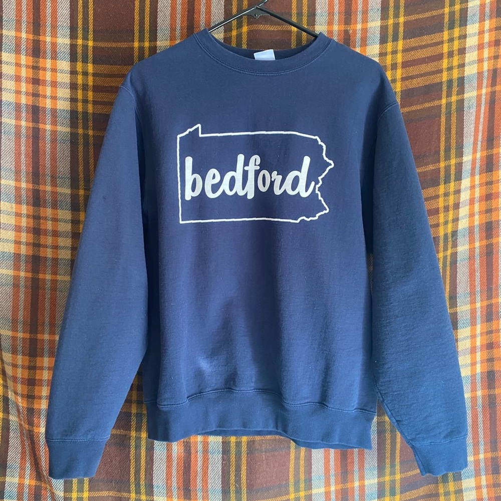 Navy blue crewneck sweater with Bedford design